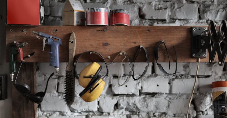 Toolkit - Various instruments hanging on wooden board in garage