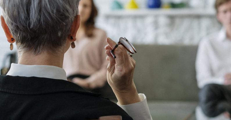 Psychology - Man in Black Suit Jacket Using Smartphone